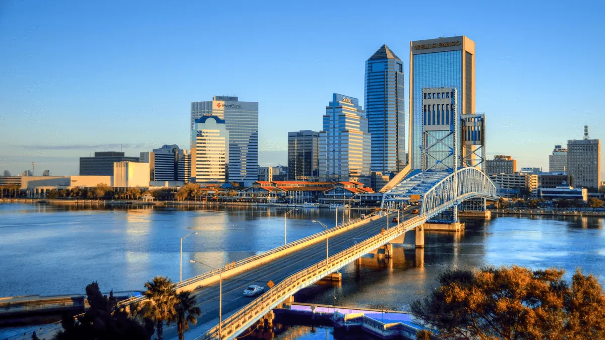 Jacksonville Florida downtown skyline with Main Street Bridge over St Johns River at golden hour