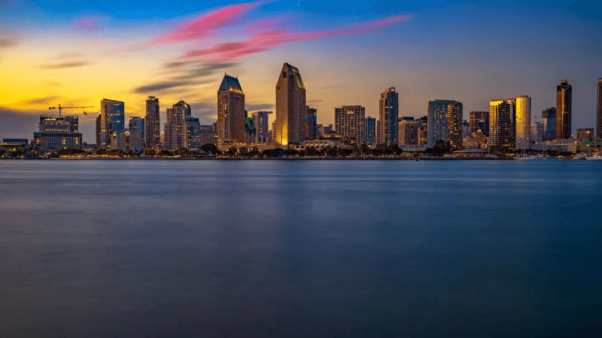 San Diego California waterfront skyline with Coronado Bridge and San Diego Bay at golden hour