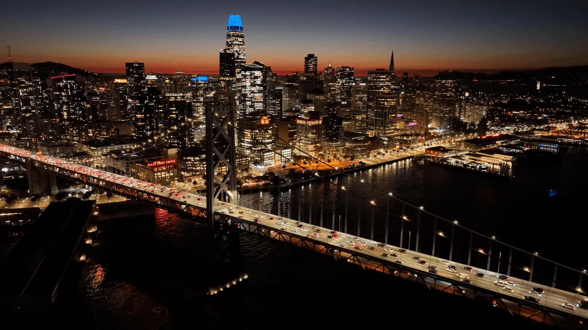 San Francisco California skyline with Golden Gate Bridge and Transamerica Pyramid at dusk with fog
